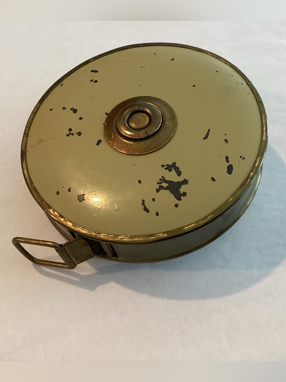 Vtg. LUFKIN Rule Co. Tape measure with a brass casing and a cream base color.